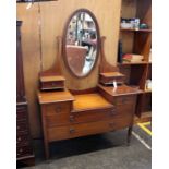 An Edwardian mahogany dressing table with string inlay decoration, an oval swing mirror, two short