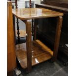 An Art Deco walnut two tier centre table on castors50cm x 50cm 65cm(H)