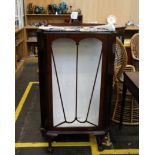 A mahogany display cabinet with glazed doors