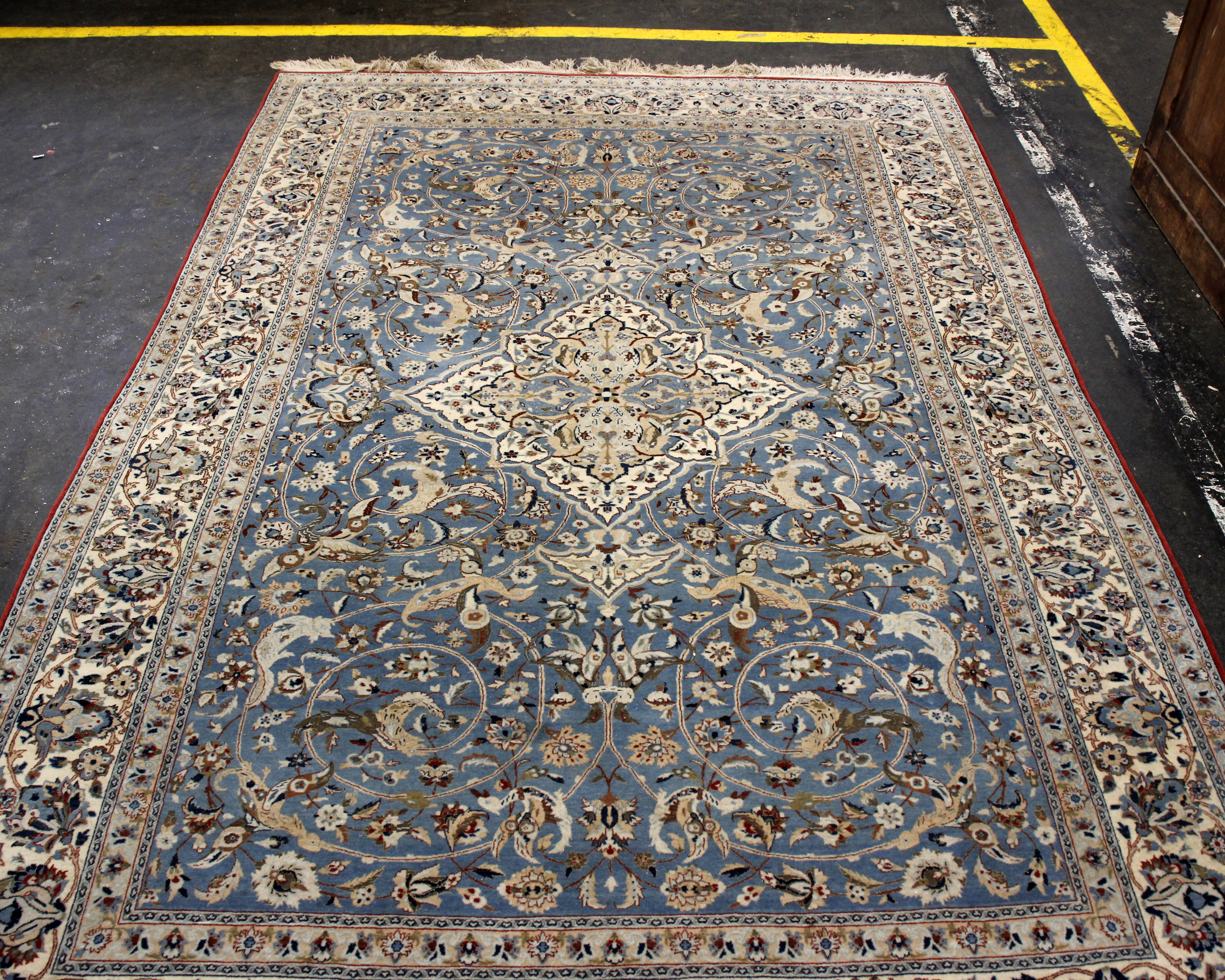 A large part silk Persian Nain Isfahan style carpet, central medallion and stylised birds and floral