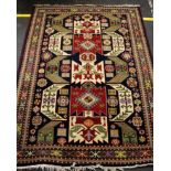 A large Afghan hand knotted wool rug, geometric pattern central field and border, predominately in
