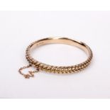 A 9ct gold bangle. 12.5g