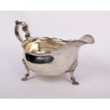 A sterling silver four footed sauceboat. Sheffield 1916 by Goldsmiths & Silversmiths Co Ltd. 310g