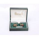 A pair of Sterling Silver Millennium cufflinks retailed by Harrods.