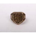 A 9ct gold gentleman's signet ring bearing the three lions England football emblem. 8.3g Size U.