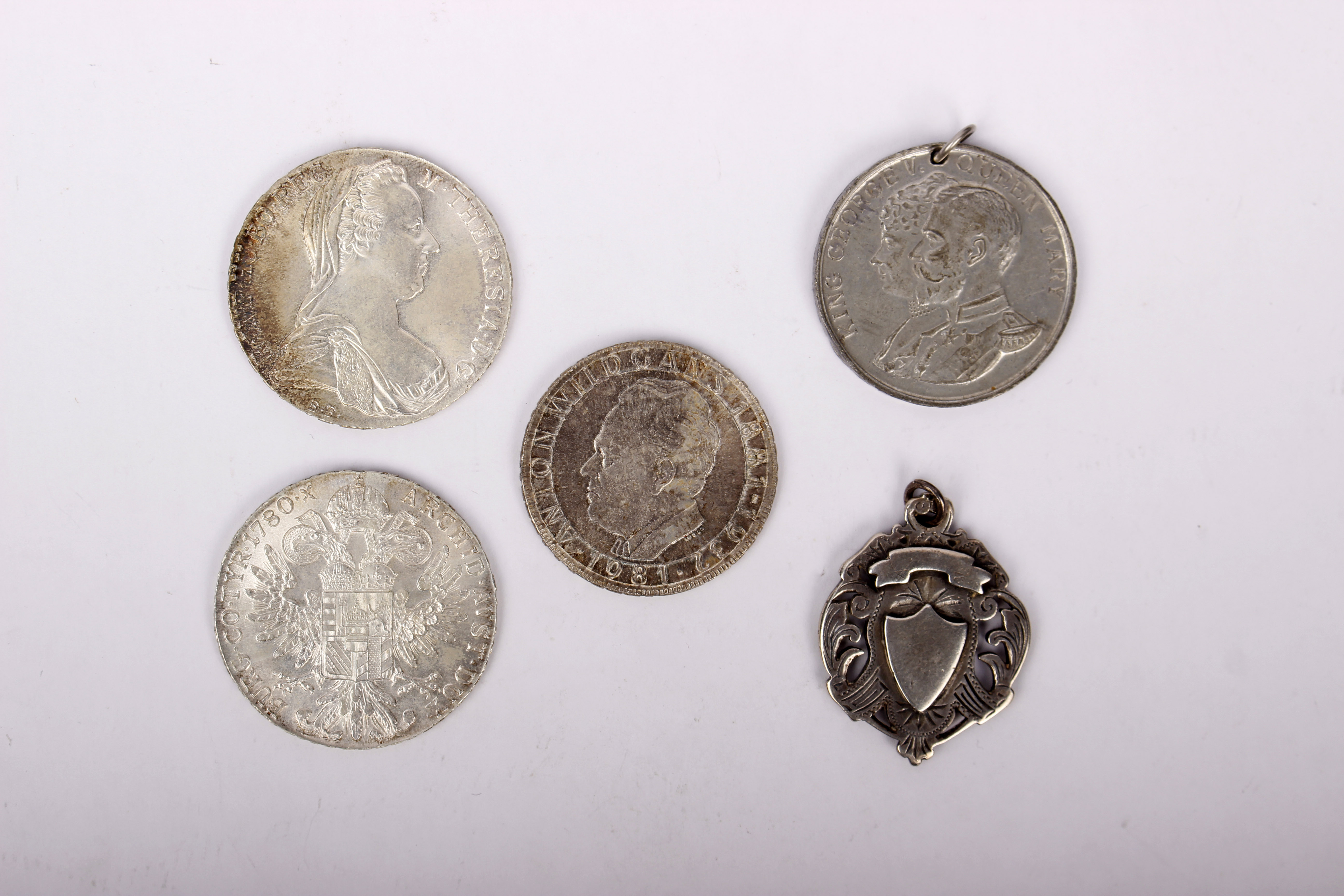 Two Maria Theresa Austrian Silver Thalers, an Austrian 500 shilling piece and a 1935 Jubilee medal