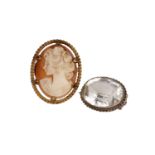 A carved cameo brooch in a yellow metal mount together with a quartz crystal brooch.