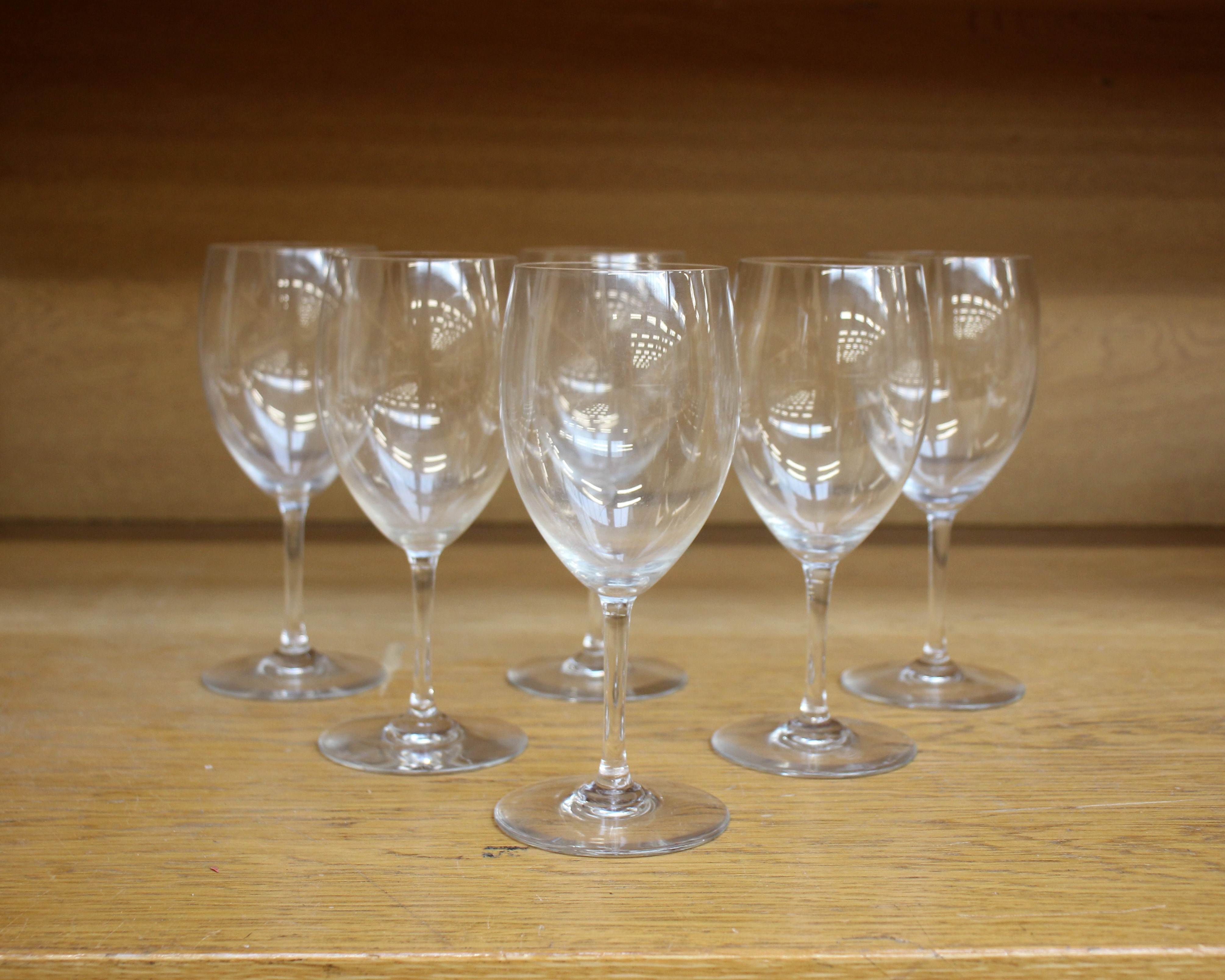 A set of six Baccarat French crystal white wine glasses, engraved Baccarat to each base.