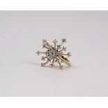 An 18k gold and diamond snow drop ring set throughout with round brilliant cut diamonds of uniform