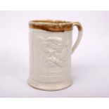 A 19th century cream ware pottery pint tankard relief moulded with period tavern scenes. (16cmH)