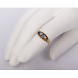 An unmarked yellow metal sapphire and diamond ring. One sapphire vacant. 3.5g. Size P.