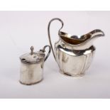 A sterling silver cream jug together with a silver mustard pot.