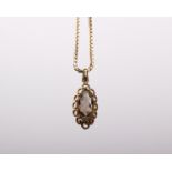 A 9ct gold box link chain together with a yellow metal pendant set with free cut smoky quartz. 10g