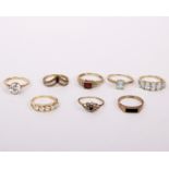 Eight 9ct gold and gem/paste set rings of various sizes. 16.5g.