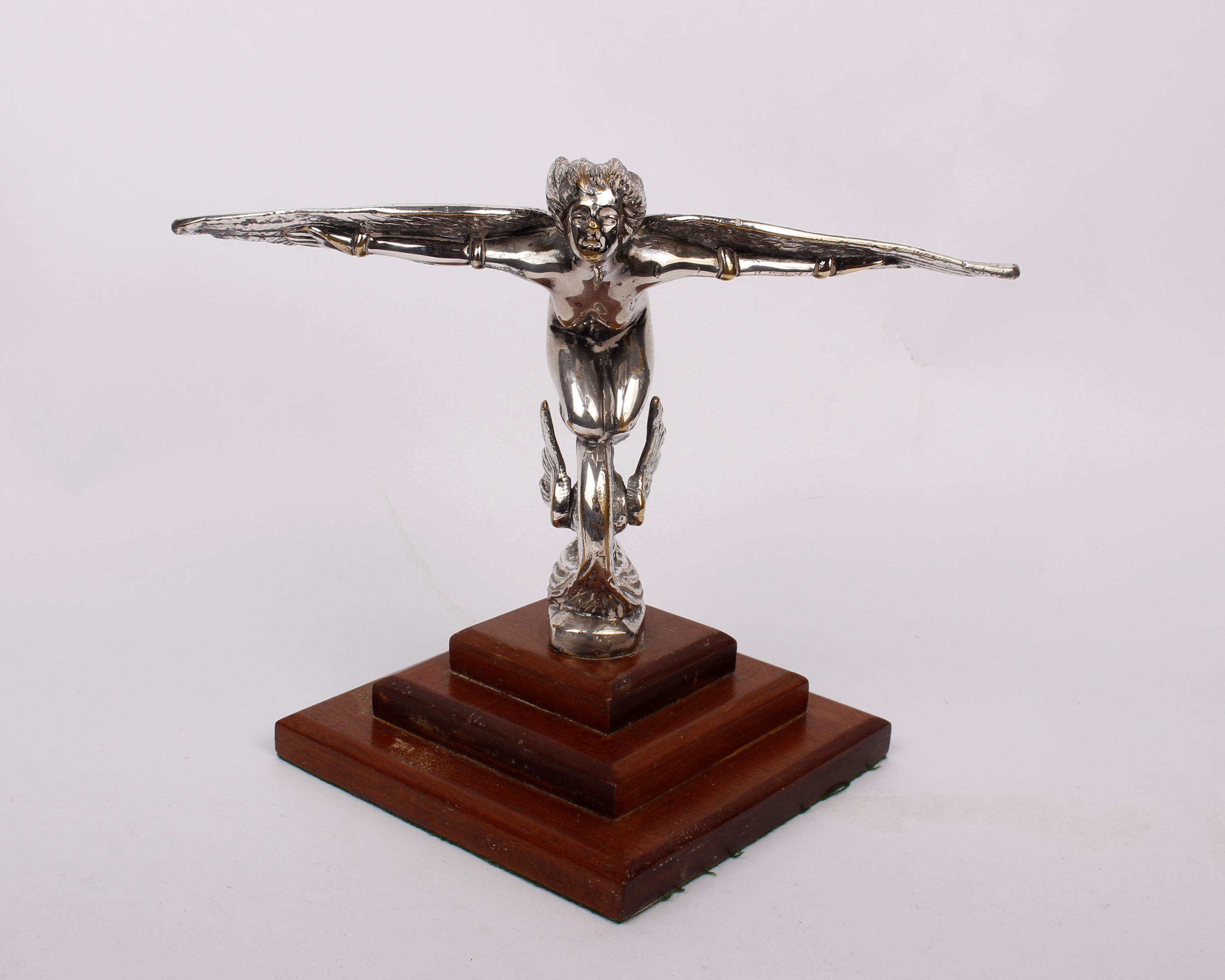 A mid 20th century plated hood ornament/ car mascot, possibly for a Packard/Cadillac. On a stepped