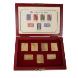 A collection of commemorative gilt silver stamps.'The Coronation Issue' 1853-1978. Seven in fitted