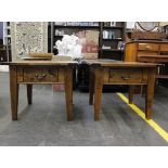 A pair of modern hardwood occasional tables each fitted with a single drawer on square tapering