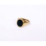 A 9ct gold gents signet ring set with oval bloodstone panel. 7.7g Size S(fitted with 9ct sizing