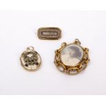 Three pieces of mourning jewellery. A double sided unmarked yellow metal picture pendant and