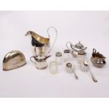 A sterling silver cream jug together with a silver hip flask cup and a collection of salts and