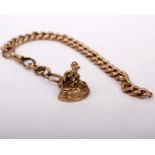 A 9ct gold curb link part Albert chain with lobster clasp and yellow metal watch fob. 12g.