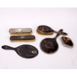 A tortoise shell and abalone shell inlaid hand held dressing table mirror together with matching