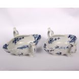 A pair of 18th Century Worcester porcelain double lipped twin handled sauce boat moulded with