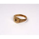A 9ct gold gents signet ring. Size W. 4.2g