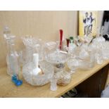 A large quantity of assorted glassware to include drinking glasses, bowls, two decanters etc