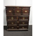 A late 17th century English joined oak coffer on chest. The top section with period paper lining