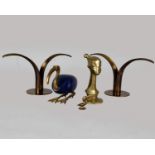 A cast brass stylised bust together with an ornament in the form of an Ibis, a pair of Sweden 'Lilly