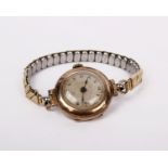 A 9ct gold wrist watch on expandable plated strap.