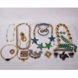 A collection of vintage couture jewellery to include Yves Saint Laurent necklaces and brooches, Joan