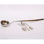 A Georgian white metal coin set toddy ladle with antler handle together with three Georgian silver