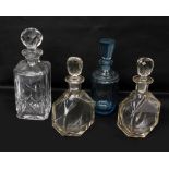 Four glass decanters 1 Aqua blue plus 3 others