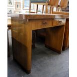 An Art Deco walnut finish serving table on pedestal supports, fitted with two drawers85cm(H) 106cm(