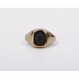 A 9ct gentleman's signet ring set with square black intaglio panel. 2.3g