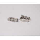 A pair of 18k white gold and diamond earrings each set with three clusters of princess and