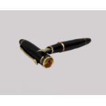 A noblest Zhenjue 930 black golden cap carved ring fountain pen.