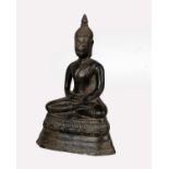A South East Asian cast bronze figure of Buddha in the lotus position