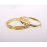 Two 14k gold bangles. 19.6g