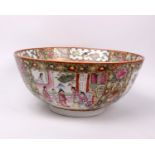 A 20th century large Chinese porcelain footed bowl painted in the famille rose pattern with four
