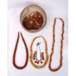 Four Amber necklaces, one in old egg yolk colour, 3 x in Honey Amber plus some Amber chips in a