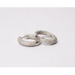 A pair of 18k white gold and diamond hoop earrings set throughout with brilliant cut diamonds. 5.3g