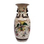 A 20th century Oriental ceramic vase with bronzed metal decoration. Hand painted with scenes of