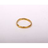 A 22k gold wedding band. 2.3g. Size Q