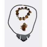 A Hematite necklace and two items of Tigers eye quartz jewellery.