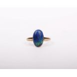 A 9ct gold and black opal doublet ring. Size R