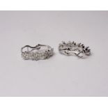 A pair of 18k white gold and diamond earrings set throughout with round and marquise cut diamonds of