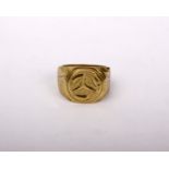 A Gentleman's yellow metal signet ring marked 18k 750. With raised central Mercedes logo